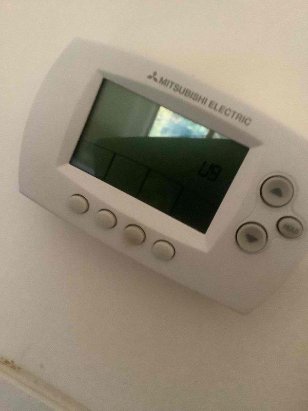 Responded to callback for Mitsubishi Electric mini split system displaying error code and not operating. Upon arrival, inspected unit and Mitsubishi thermostat control, which was previously non-responsive. Performed system diagnostics and cleared error code from controller. Cycled system power and verified thermostat display restored to normal operation showing temperature reading of 76°F. Confirmed all control functions operational and mini split system running properly with no active error codes.
