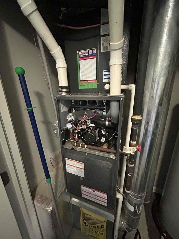 Performed second opinion inspection of furnace system following concerns raised by previous contractor regarding corroded piping and cabinet cleanliness. Inspected PVC venting system, internal furnace components, gas connections, and blower assembly with access panel removed. Evaluated condition of condensate drain lines and filter cabinet area above blower compartment to provide assessment and recommendations for pipe repair versus replacement options.