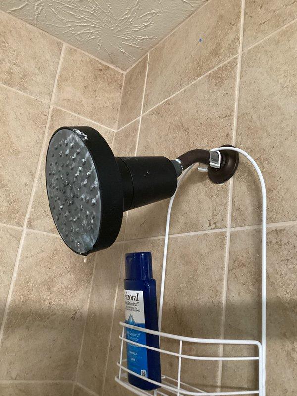 Responded to service call for leaky faucet inspection. Upon arrival, assessed multiple plumbing fixtures including main water supply valve assembly with shutoff controls and shower fixtures. Inspected chrome-plated valve connections, copper pipe fittings, and associated plumbing components for signs of leaks or deterioration. Examined shower head installation and water delivery system for proper function and potential leak sources. Documented existing conditions with photographs for repair recommendations and provided customer with diagnostic findings regarding faucet and fixture conditions requiring attention.