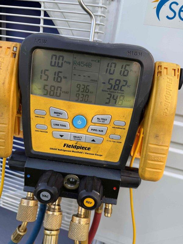 Installed customer-provided ductless mini-split system, mounting the wall-mounted indoor unit and outdoor condenser, running the line set, and completing electrical connections at the panel. Performed nitrogen pressure test and evacuation using a digital manifold and vacuum gauge, then charged the system with R454B refrigerant and verified operation.