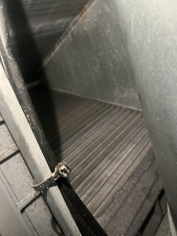 Performed a complete seasonal tune-up on the Daikin furnace and heat pump system, inspecting the electrical control compartment, wiring connections, and air handler interior. Documented heavy dust and debris buildup on the evaporator coil fins and surrounding cabinet surfaces, along with loosely routed control wiring, and verified the system was operating normally with no faults or performance issues reported.