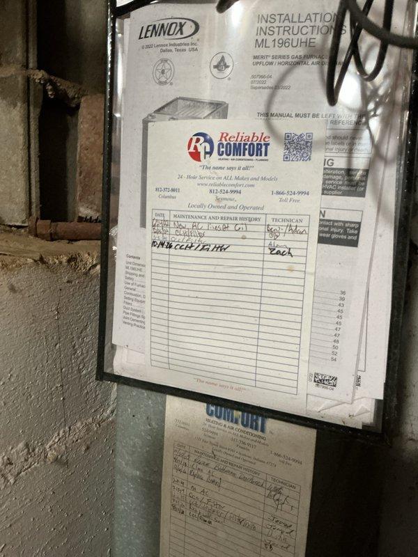 Performed scheduled monthly heating maintenance on the Lennox ML196UHE Merit Series gas furnace, including replacement of the 16x25x1 air filter and inspection of the unit's operating condition and service history documentation. Observed no frost, ice, or major damage at the furnace; noted heavy rust and corrosion at the base of the adjacent water heater tank, recommending that it be monitored or evaluated for replacement.
