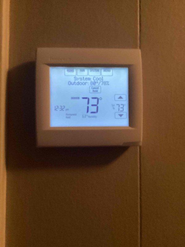 Performed scheduled monthly heating maintenance, including inspection of the thermostat and return air filter access panel. Verified thermostat operation (73° setpoint, system set to cool, permanent hold active) and found the unit in good working condition. Inspected the return air grille, noted light dust accumulation on the louvers and minor slat deformation on the lower left section, and installed a new 16x20x1 filter to maintain proper airflow.