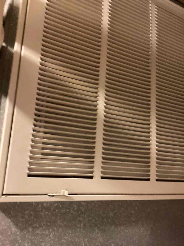 Performed scheduled monthly heating maintenance, including inspection of the thermostat and return air filter access panel. Verified thermostat operation (73° setpoint, system set to cool, permanent hold active) and found the unit in good working condition. Inspected the return air grille, noted light dust accumulation on the louvers and minor slat deformation on the lower left section, and installed a new 16x20x1 filter to maintain proper airflow.