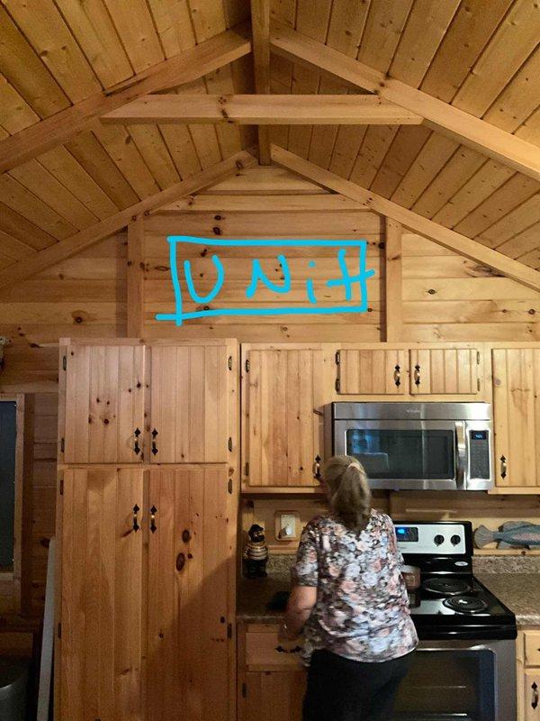 Performed an on-site assessment for a ductless mini split installation in a 500 sq ft cabin with vaulted knotty pine ceilings. Evaluated the kitchen's upper wall above the cabinetry as the proposed indoor air handler location, accounting for the open vaulted layout and nearby electrical service. Documented site conditions with photos to support equipment sizing, line set routing, and electrical requirements for the installation proposal.