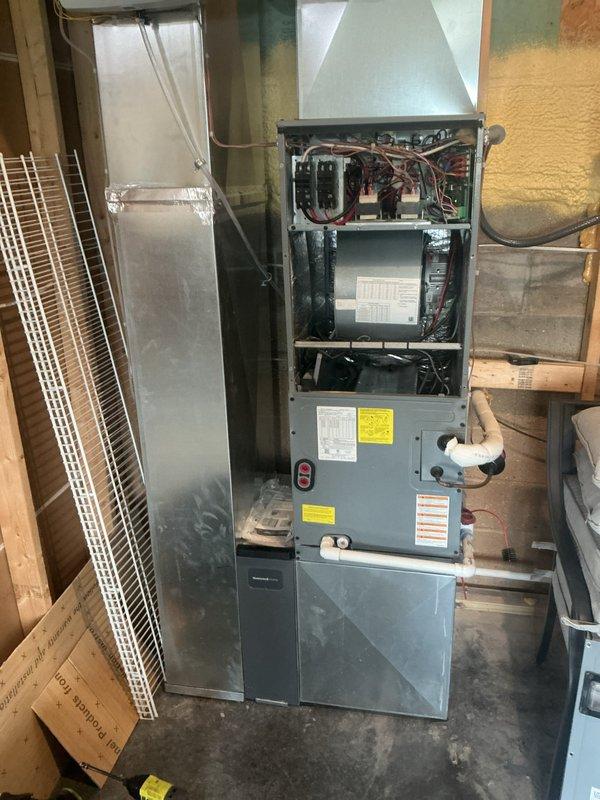 Performed routine monthly heating maintenance on two systems, inspecting the indoor air handler's blower assembly, control board, wiring, and condensate drain piping, as well as the outdoor condenser's electrical compartment, including the dual-run capacitor, wiring connections, and control board. Verified proper component condition and system operation, with no signs of frost, rust, or major damage observed. Noted dust and debris accumulation and surrounding vegetation near the outdoor unit, and the 20x20x4 filter was not included in this visit.