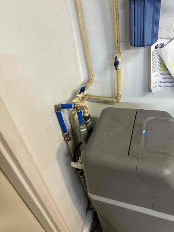 Responded to an emergency no-water call caused by damaged water softener supply lines and isolated the affected section of the system. Replaced the broken connections with new flexible PEX tubing and brass crimp fittings, secured with clamps, then reopened the shutoff valves to restore water service. Verified the repair was leak-free and confirmed normal flow and pressure throughout the home.