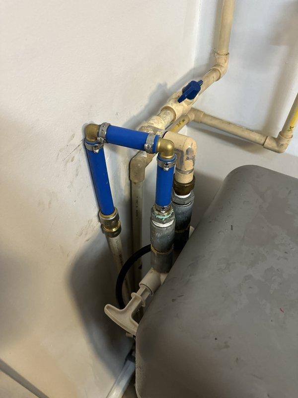 Responded to an emergency no-water call caused by damaged water softener supply lines and isolated the affected section of the system. Replaced the broken connections with new flexible PEX tubing and brass crimp fittings, secured with clamps, then reopened the shutoff valves to restore water service. Verified the repair was leak-free and confirmed normal flow and pressure throughout the home.