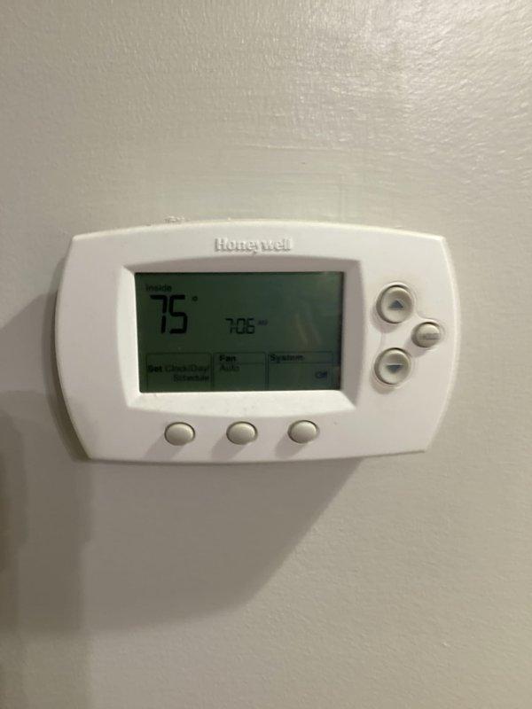Responded to a no-cooling complaint with the outdoor unit running and moisture present at the air handler. Found the thermostat set to System: Off at 75°F indoor temperature; inspected the furnace/air handler assembly, condensate drain piping, and refrigerant line set, then verified proper operation of the cooling system with the thermostat set to cool.