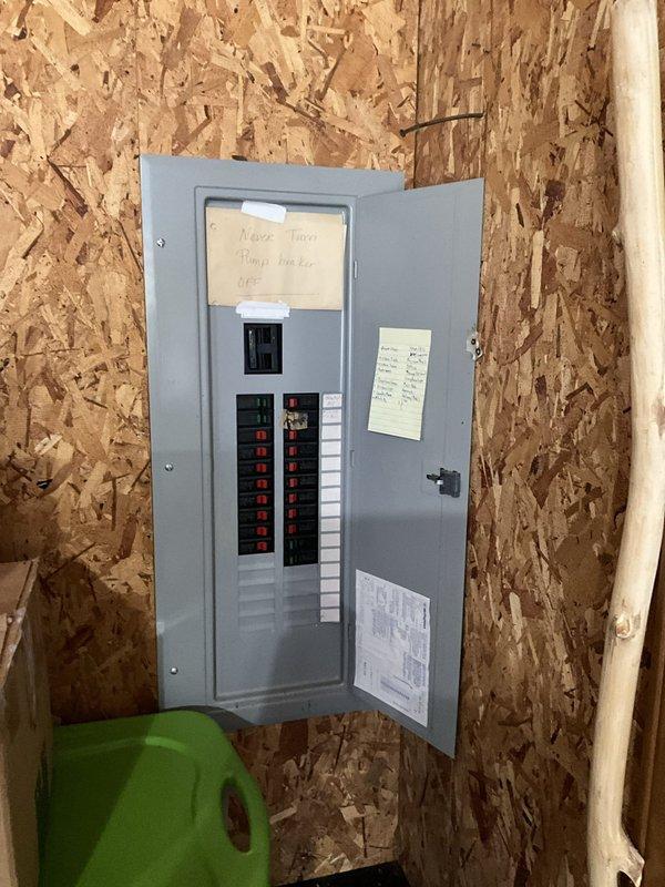 Evaluated a 1,500 sq ft residence with original 30+ year-old natural gas furnace and split AC system, with reusable crawlspace ductwork supporting a direct changeout. Documented failing fan and compressor controls and corrosion on the condenser coil fins, with heavy vegetation encroaching on the outdoor unit and the electrical panel inspected for equipment circuiting. Prepared two replacement options, an 80% gas furnace only and a furnace paired with a 15.2 SEER2 AC for utility rebate eligibility, with a new thermostat and C-wire installation itemized separately and the estimate validity period provided in writing.