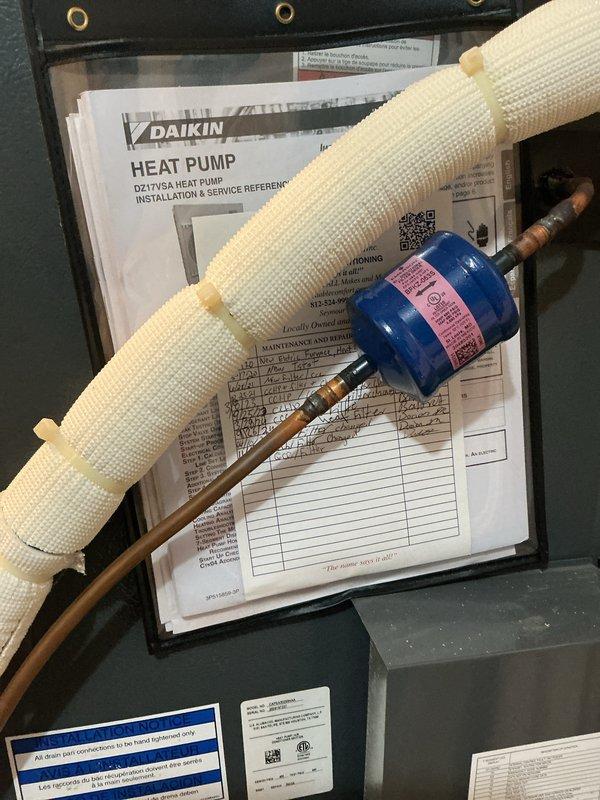Performed monthly preventive maintenance on the Daikin heat pump air handler, including inspection of the unit cabinet, refrigerant line insulation, filter drier, and PVC condensate drain assembly, with no visible frost, ice, rust, or damage observed. Serviced the 20x20x4 filter per the monthly schedule (filter supplied separately) and updated the on-unit service log to document the visit.