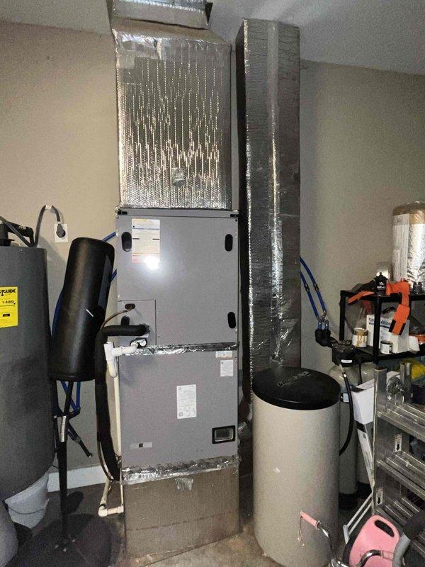 Performed annual heating maintenance inspection on the air handler, including inspection of the blower assembly, evaporator coil compartment, condensate drain piping, refrigerant line insulation, and ductwork connections, and serviced the washable filter. Noted light frost or moisture residue on the evaporator coil and refrigerant lines along with a slight lean in the coil, and recommended further evaluation of refrigerant charge and airflow. No rust or damage observed on the unit, and the system is operating normally for heating.