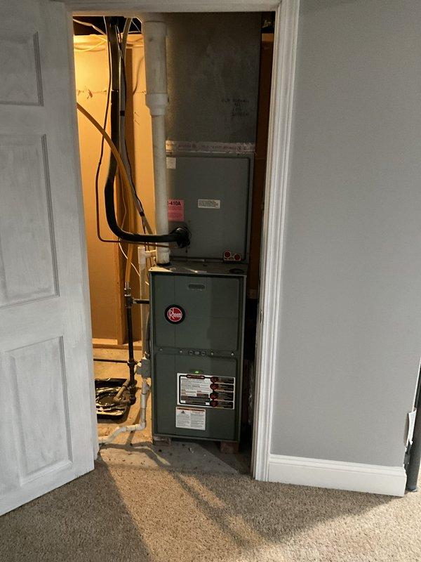 Performed a comfort consultation and inspection of the cooling system, including the outdoor condenser unit and the Rheem gas furnace with R-410A evaporator coil cabinet. The system was found to be low on refrigerant and the unit's age was noted as a factor in recommending replacement. The homeowner was unavailable during the visit, so the replacement estimate was scheduled for a later appointment.