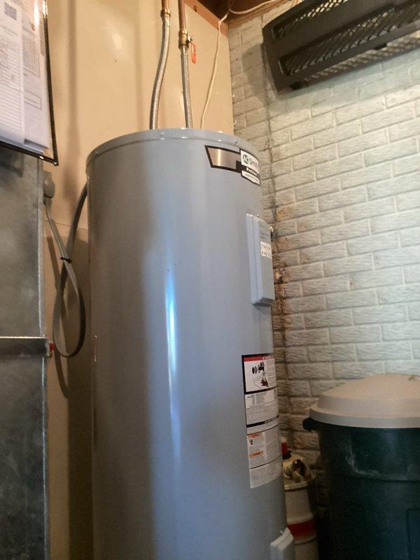 Performed a six-month preventive maintenance tune-up on the heat pump system (approximately 5 years old) and verified proper operation in heating mode, with the thermostat calling for heat at a 70° setpoint and the system responding normally. No faults or performance issues were identified. During the visit, noted a stain on the brick wall beside the electric water heater and documented the area for the customer's awareness.