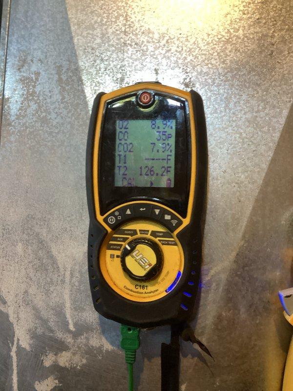 Performed a seasonal tune-up and cleaning on the furnace prior to heating season, inspecting the cabinet interior, removing accumulated dust and debris, and verifying the 16x25x1 filter fit, with torn duct tape noted at the filter slot. Conducted a combustion analysis, recording O2 at 8.9%, CO at 35 ppm, CO2 at 7.9%, and flue temperature of 126.2°F, and confirmed the unit was operating safely and ready for use.