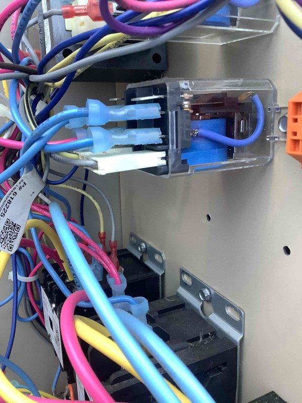 Responded to a warranty call for a multi-unit cooling system with two units running continuously and two units failing to start. Inspected the zone thermostat and confirmed settings and display operation, then inspected the control panel, including the plug-in control relay, contactor wiring, and low-voltage connections, finding no visible damage, corrosion, or burn marks. Verified control circuit operation to isolate the faulty call-for-cooling and non-start conditions.