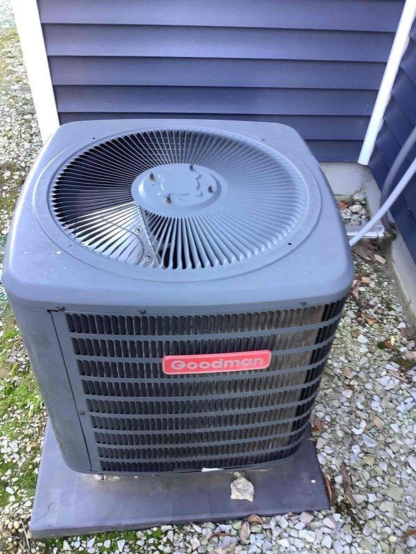 Responded to a no-heat complaint on a split system consisting of an indoor Goodman gas furnace and an outdoor Goodman condenser, where cooling operated normally. Inspection showed the heating source is a gas-fired furnace, not an all-electric heat pump, so the system is a conventional air conditioner and furnace combination; the furnace has an intact gas supply with shutoff valve, PVC vent and drain piping, and no visible corrosion or damage. The outdoor condenser coil was noted to be dirty with debris buildup and leaf accumulation around the pad, and cleaning of the coil and surrounding area is recommended to maintain cooling efficiency.