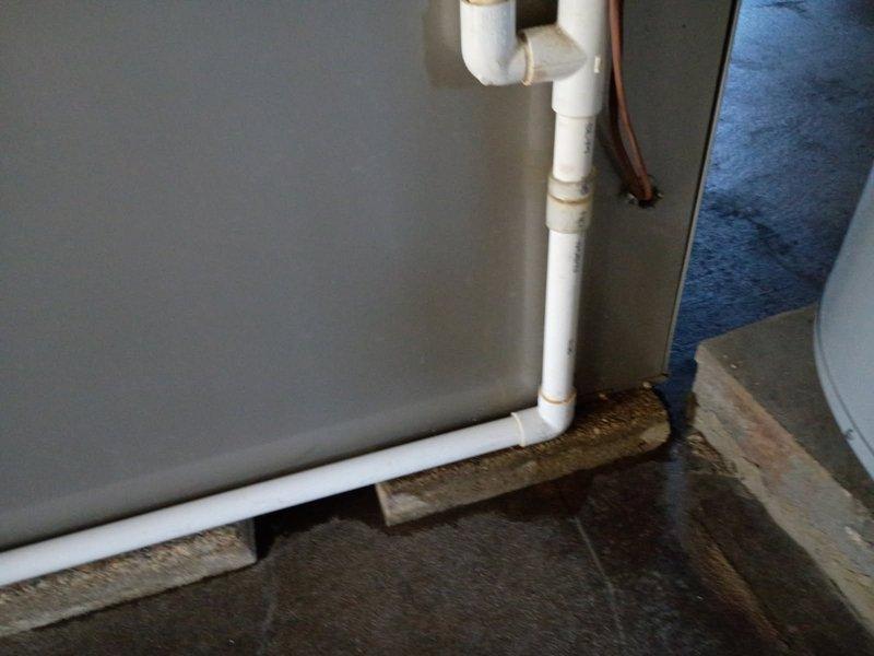 Performed annual maintenance inspection on the unit, including a visual check of the condensate drain piping, cabinet interior, and internal electrical wiring. Documented wet floor conditions and residue at the PVC drain joints, indicating possible condensate leakage, and recommend further evaluation of the drain line connections. Verified hose clamps and fittings were secure and noted loose internal wiring for follow-up.