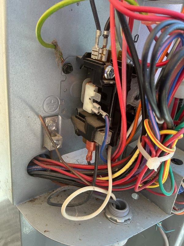 Performed seasonal tune-up and inspection on the heat pump (Daikin DZ14SA0301KE) and gas furnace (approx. 7 years old); both systems were operating properly with no deficiencies found. Inspected the outdoor unit's electrical compartment, verifying contactor, grounding, and wiring connections were secure with no signs of burn damage, rust, or frost, and noted only light dust and debris. Verified supply air temperature at the foil-wrapped duct using a digital pocket thermometer, which read 123.6°F, confirming normal heating performance.