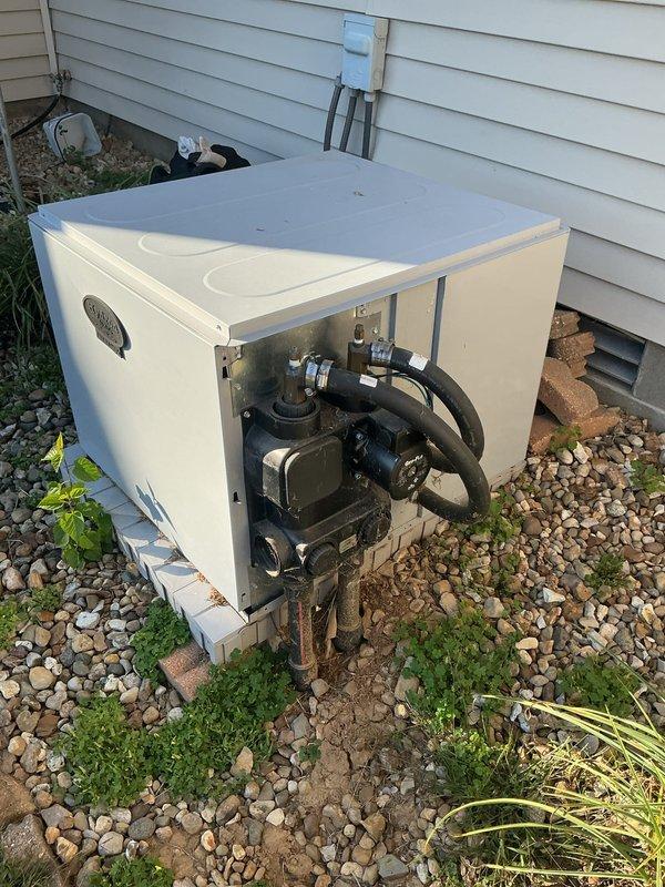 Performed scheduled monthly heating maintenance on a geothermal heat pump system, inspecting the outdoor unit's open access panel, circulator pump, valve assembly, and insulated loop piping and confirming proper connections at the ground loop. Inspected the indoor air handler, refrigerant line insulation, and condensate drain assembly, and replaced the air filter as part of the recurring filter service. Verified system operation and found no issues requiring further repair.