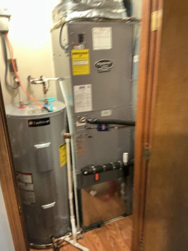 Performed scheduled monthly heating maintenance on a geothermal heat pump system, inspecting the outdoor unit's open access panel, circulator pump, valve assembly, and insulated loop piping and confirming proper connections at the ground loop. Inspected the indoor air handler, refrigerant line insulation, and condensate drain assembly, and replaced the air filter as part of the recurring filter service. Verified system operation and found no issues requiring further repair.