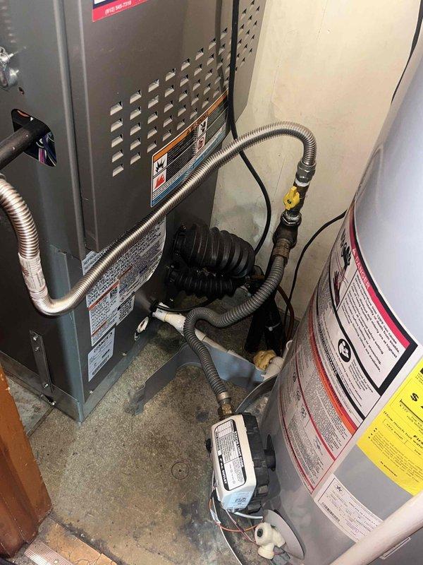 Performed seasonal heating maintenance on the gas furnace, including inspection of the burner assembly, heat exchanger, gas connections, venting, and condensate/PVC drain components, and installed a new 16x25x5 air filter. Verified proper furnace operation, inspected the flexible gas lines and shutoff valves for integrity, and confirmed the adjacent water heater gas connections were secure. The outdoor condenser was inspected and found clean and intact with no visible damage, and the system was left operating normally.