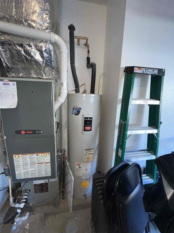 Performed a monthly heating maintenance visit on the Trane KX95 gas furnace, including removal and inspection of the 16x20x1 return air filter and a general system check in the equipment closet. Inspected the air handler's A-coil and found notable rust staining along the coil face, with corrosion and discoloration on the cabinet floor near the condensate piping and refrigerant lines, indicating possible moisture or leakage issues. Recommend further evaluation of the evaporator coil and condensate drainage to prevent further deterioration.