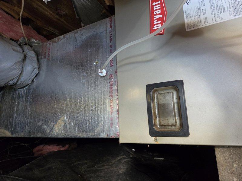 Replaced the failed blower motor on the Bryant air handler. The existing motor and blower assembly was removed from the unit, and a new ECM-style blower motor was installed and secured to the housing bracket arms. Reassembled the cabinet and access panel, then verified proper blower operation.