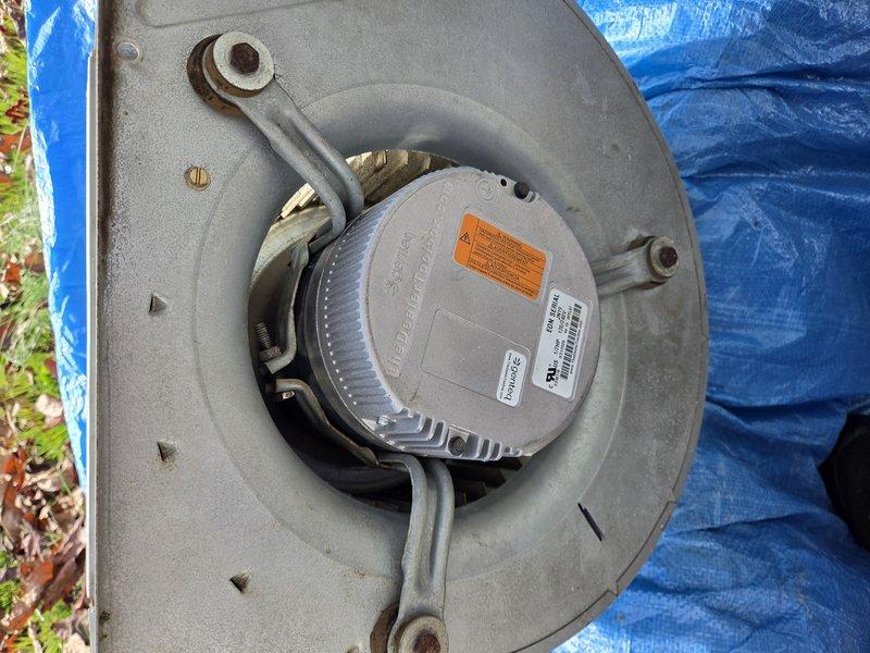 Replaced the failed blower motor on the Bryant air handler. The existing motor and blower assembly was removed from the unit, and a new ECM-style blower motor was installed and secured to the housing bracket arms. Reassembled the cabinet and access panel, then verified proper blower operation.