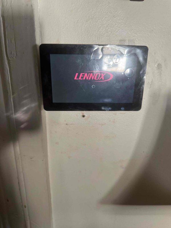 Installed a 2.5-ton heat pump with matching evaporator coil, integrating it with the existing gas furnace and supply plenum in a dual-fuel configuration. Connected the line set, condensate drain, and low-voltage controls, and verified startup of the Lennox touchscreen thermostat for proper system communication and operation.