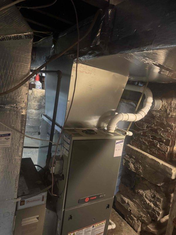 Installed a 2.5-ton heat pump with matching evaporator coil, integrating it with the existing gas furnace and supply plenum in a dual-fuel configuration. Connected the line set, condensate drain, and low-voltage controls, and verified startup of the Lennox touchscreen thermostat for proper system communication and operation.