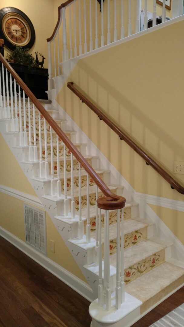 Robert E. Lee meeting with Joe Norwood and his client Ann to give some suggestions on stain colors for the bannister and to have the top of her solid Oak Doing Room Table refinished with a satin gloss.