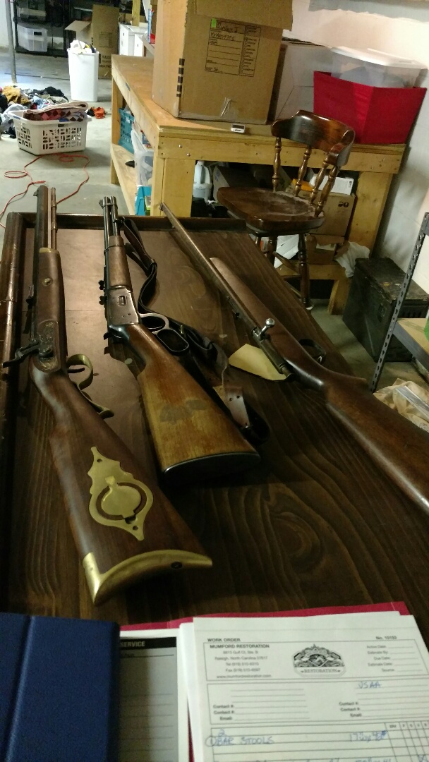 Mumford Restoration picking up Damaged Barstools, Bar and antique guns from customer in Southern Pines due to a flooded basement!