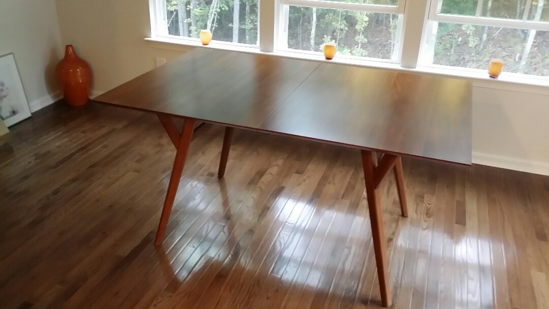 Repaired and touch up on a dining room table.