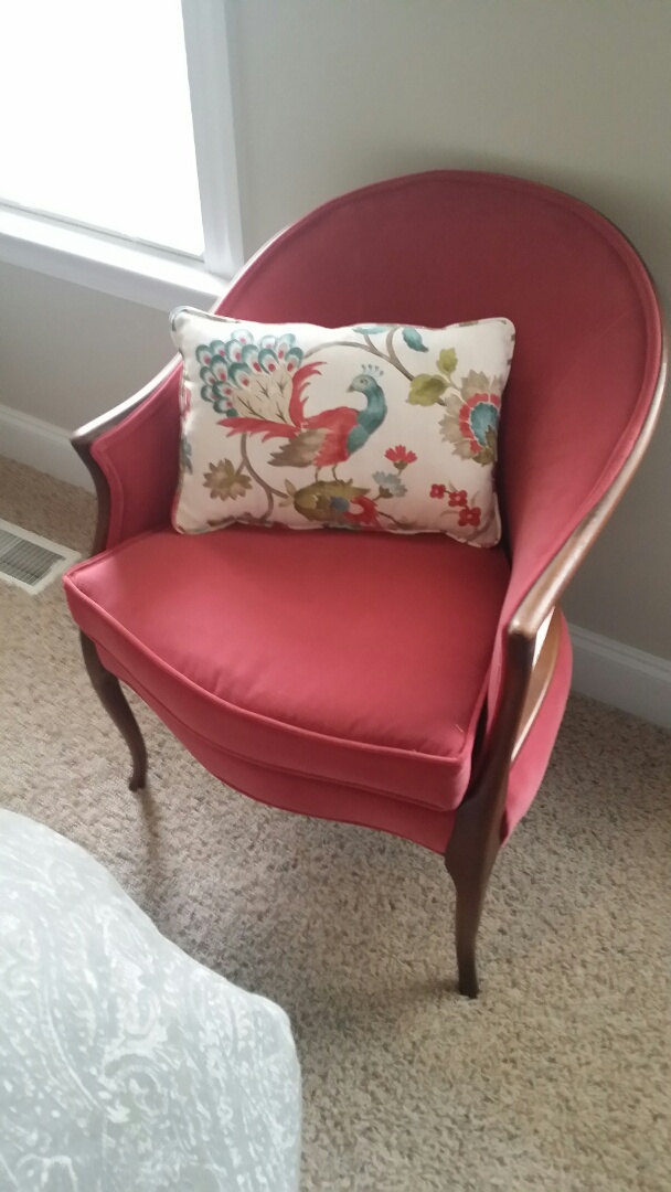 Reupholstered arm chair and throw pillow