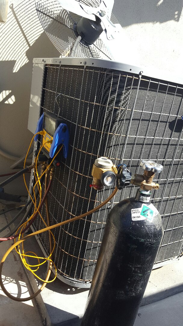 Refrigerant leak repair on a Carrier condensing unit