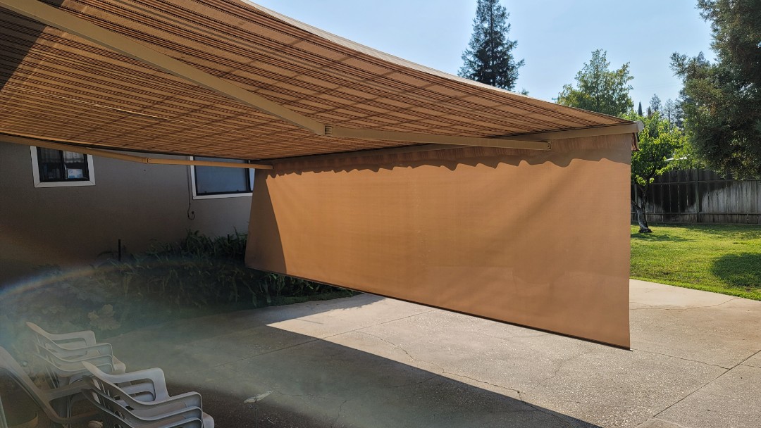 Lincoln, CA - Here us a Sunesta Retractable Awning, installed in 2008, that needs new fabric. It is 18 x 14.8 with a 5' drop screen, that drops out of the front bar of the awning to help shade the house and patio from that end of the day sun, that happens every day. Lincoln, CA - Here us a Sunesta Retractable Awning, installed in 2008, that needs new fabric. It is 18 x 14.8 with a 5' drop screen, that drops out of the front bar of the awning to help shade the house and patio from that end of the day sun, that happens every day.