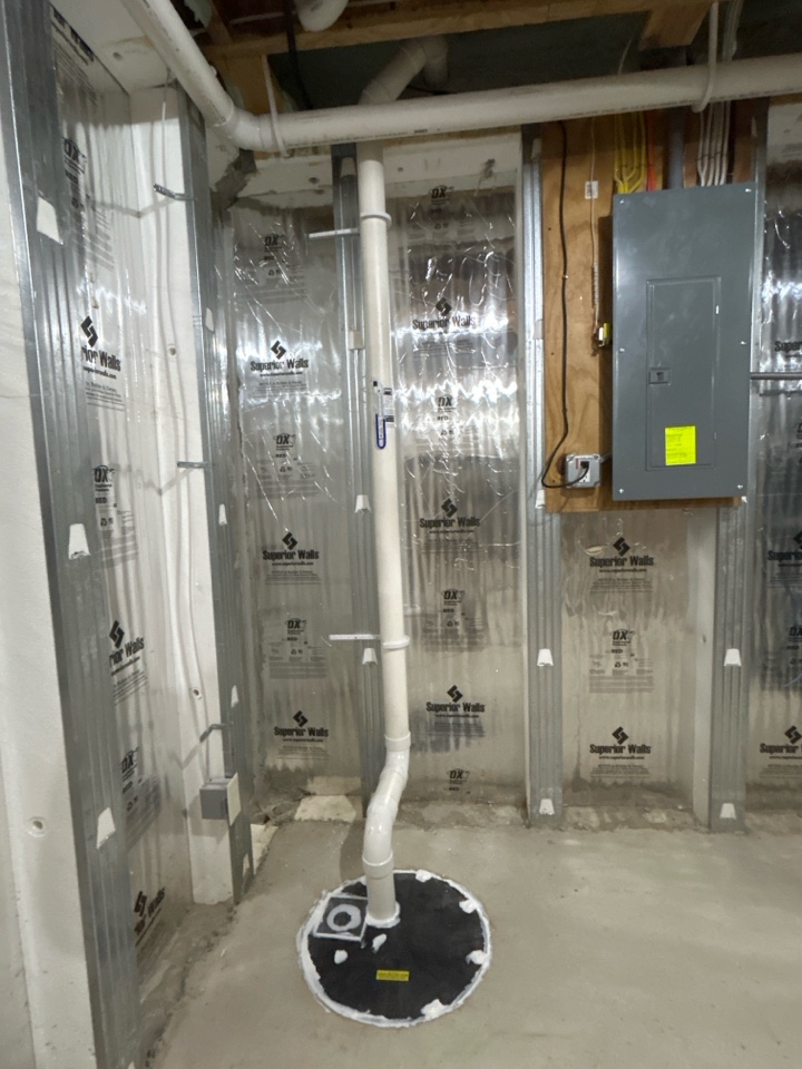 Radon mitigation system installation into sump crock for The Dwelling Place! 