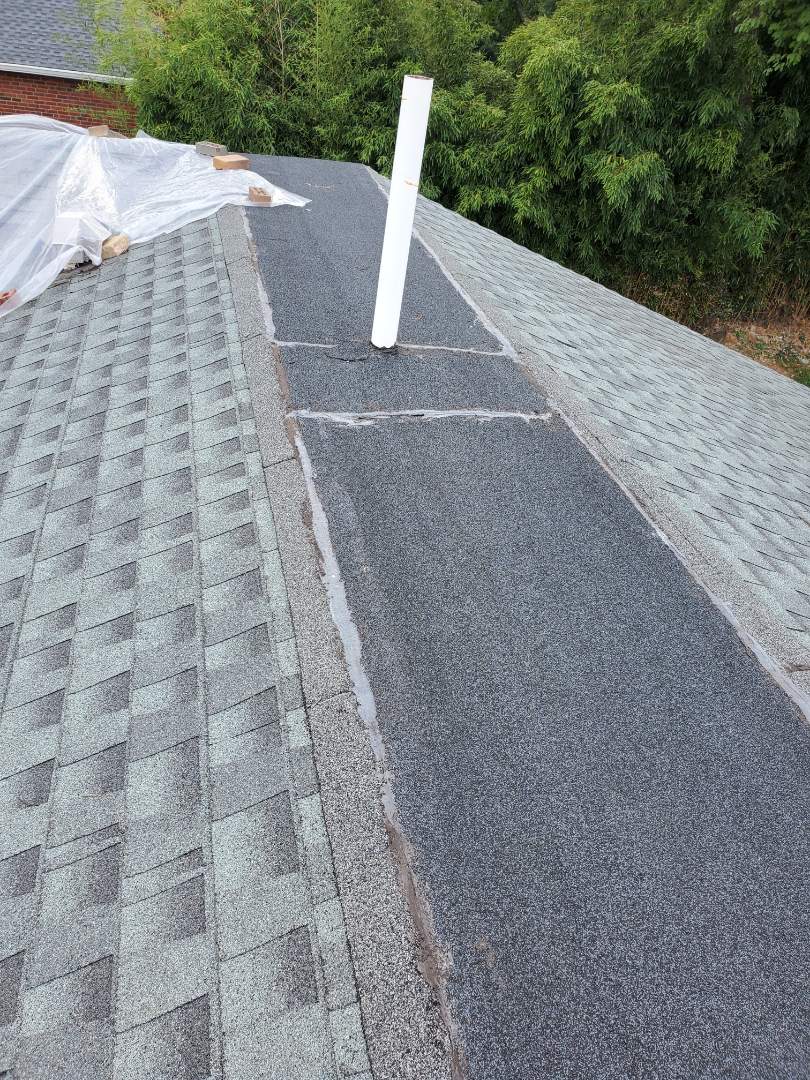 Alexandria, VA - AST Roofing was called in to identify source of several leaks in this private residence in Alexandria. AST Roofing found prior roofer had incorrectly installed shingles and incorrectly installed the flat section of roof which covers area where a ridge would be. Alexandria, VA - AST Roofing was called in to identify source of several leaks in this private residence in Alexandria. AST Roofing found prior roofer had incorrectly installed shingles and incorrectly installed the flat section of roof which covers area where a ridge would be.