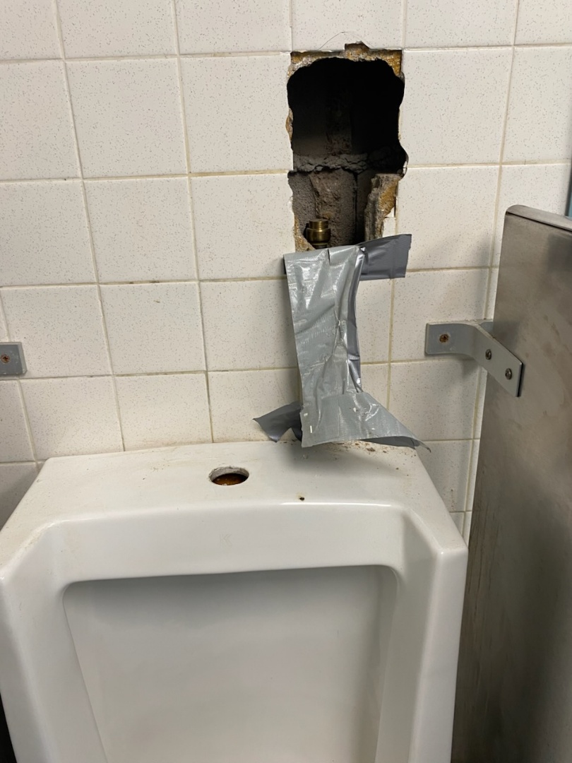 Repairing a urinal that broke off the wall
