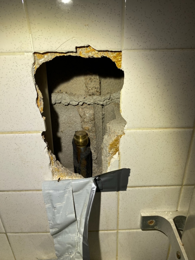 Repairing a urinal that broke off the wall