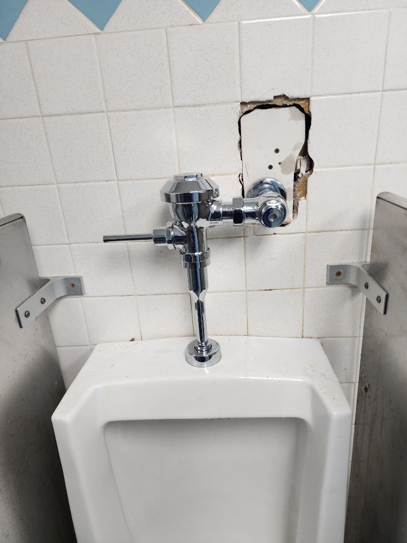 Repairing a urinal that broke off the wall