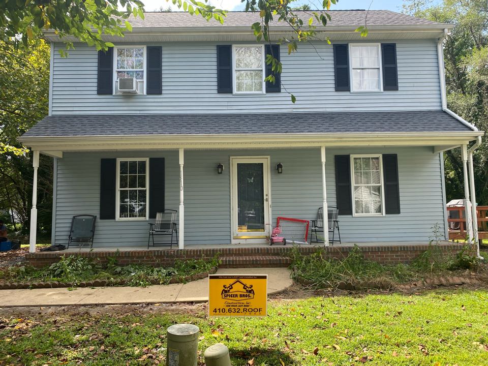 We just finished replacing this house with brand new Timberline HDZ shingles pewter grey in color and installed a new ridge vent using GAF snow country.