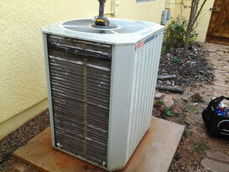 Cleaning the condenser coil on a Trane XE 1200