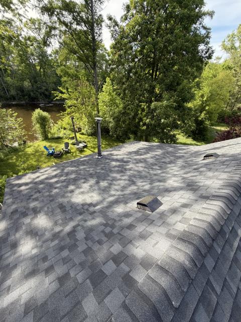 Maximum storm resistance was the primary focus for this project in Glendale! Rather than a standard eave-only barrier, our crew applied a full-deck ice and water shield membrane across the entire roof surface before installing a CertainTeed NorthGate ClimateFlex Class 4 impact-resistant shingle system in Moiré Black. We also carefully detached the home's existing gutters, resetting them with heavy-duty aluminum fascia brackets and custom-tuning the pitch to optimize flow directly toward the original downspouts.