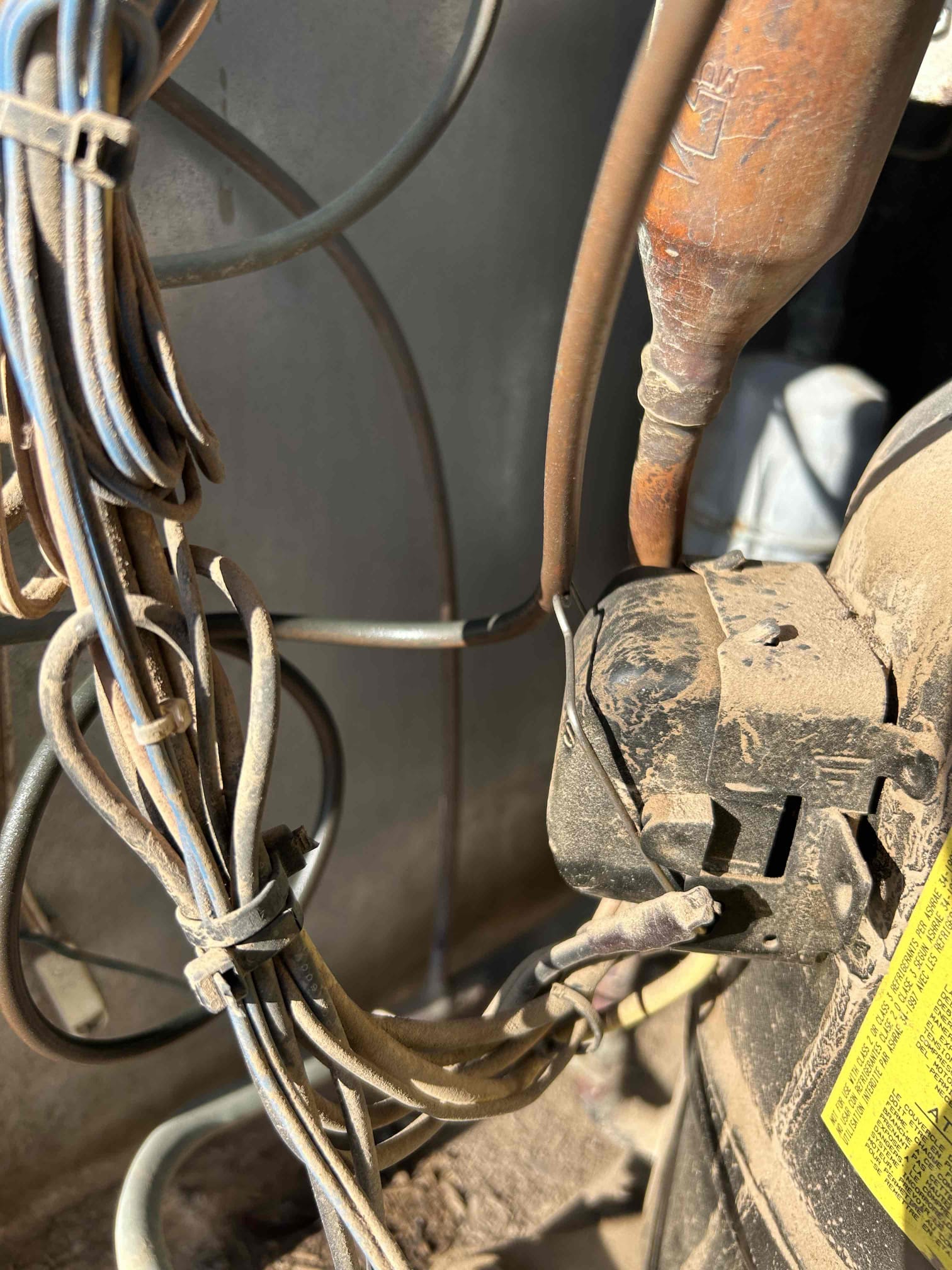 System is found with no Freon. Multiple leaks detected, one is at the core calve and the other on the copper pipe. Pipe rubbed against the compressors  plug cap. I tested the compressor and it has open windings. System is need of a new compressor, braze repair, and contains r22 Freon. Spoke to homeowner over repairs and advised that for the age of the system new equipment install is also an option. System is down at departure.