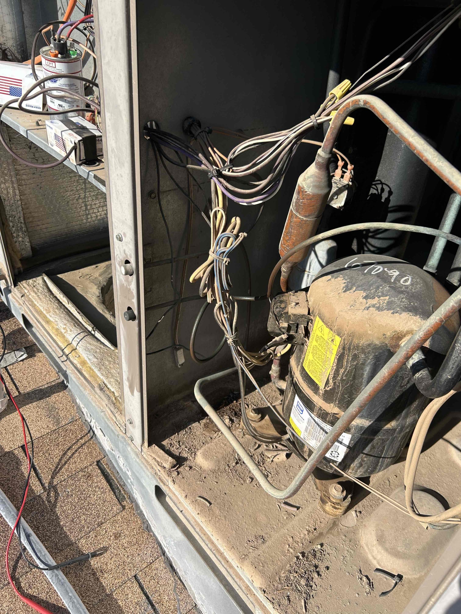 System is found with no Freon. Multiple leaks detected, one is at the core calve and the other on the copper pipe. Pipe rubbed against the compressors  plug cap. I tested the compressor and it has open windings. System is need of a new compressor, braze repair, and contains r22 Freon. Spoke to homeowner over repairs and advised that for the age of the system new equipment install is also an option. System is down at departure.