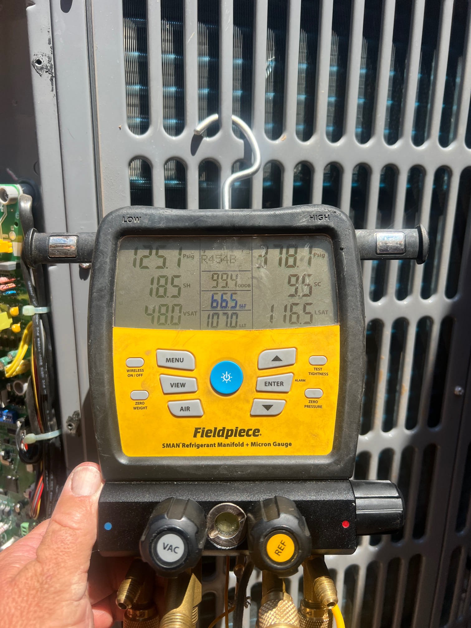The home has a ductwork issue. The upstairs is getting satisfied at 74° and the downstairs is staying hot 82 to 85°. I checked the system and found it properly charged and is producing a low temperature split of 16°. The true gauge readings and charge will need to be evaluated once the ductwork issues are resolved on the system to verify proper charge. 