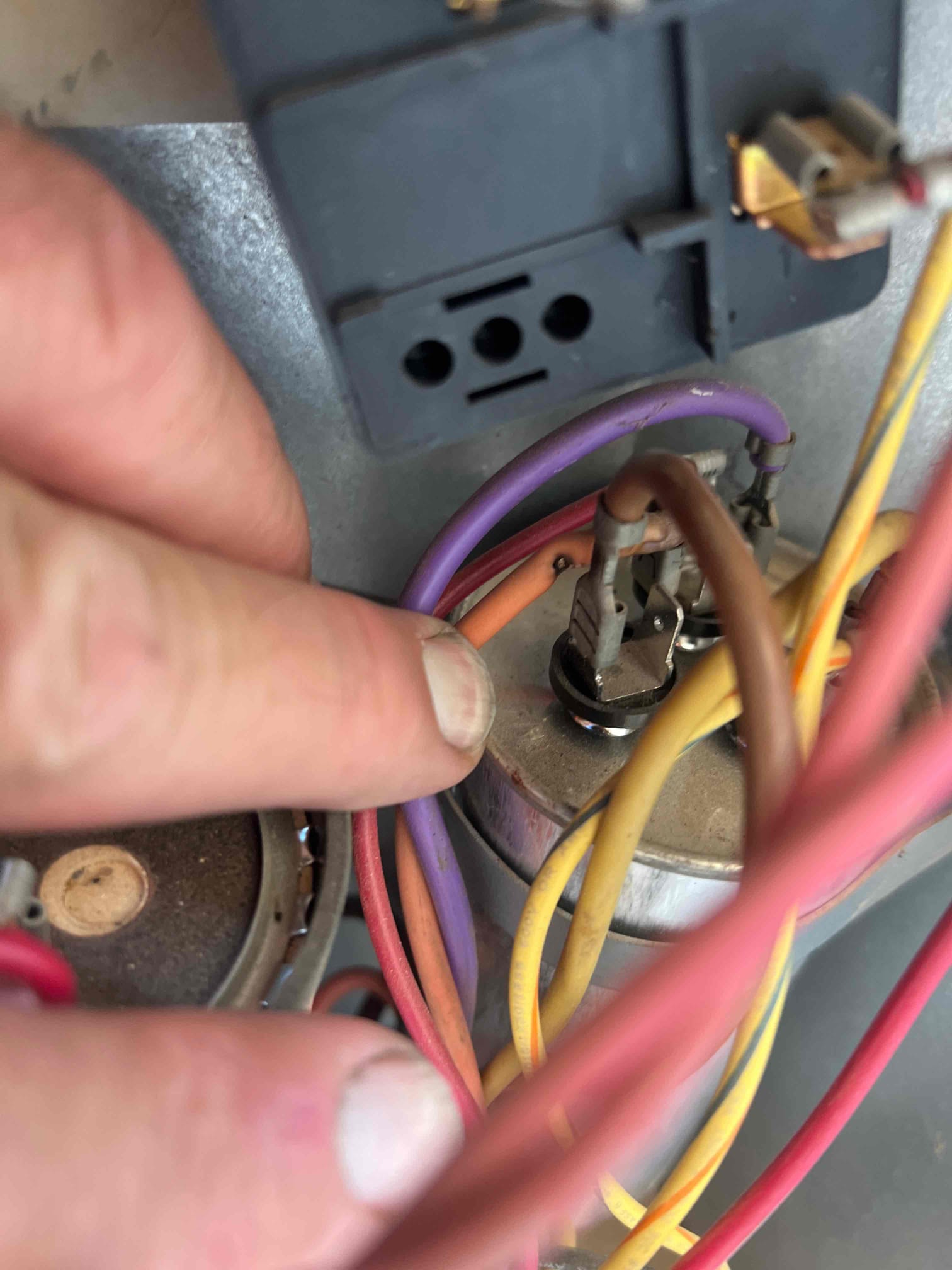 The common wire had shorted to the capacitor run wire for the outdoor fan motor, causing the motor to not operate. I repaired the wires and verified operation. The unit is operating properly at this time.
