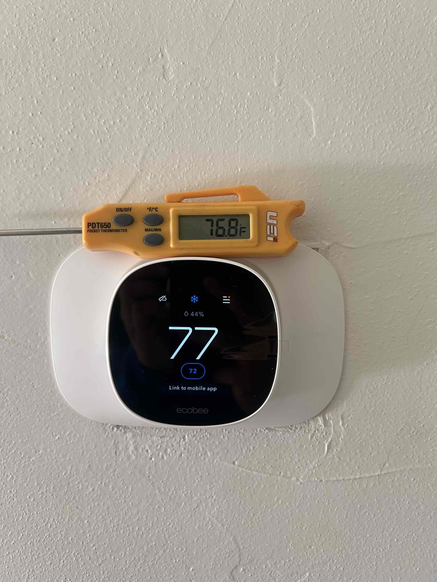 South unit had a failed float switch which lead to water leaking at the air handler. On the north side unit I adjusted the threshold temperature setting at the thermostat as it was off by 5 degrees. 